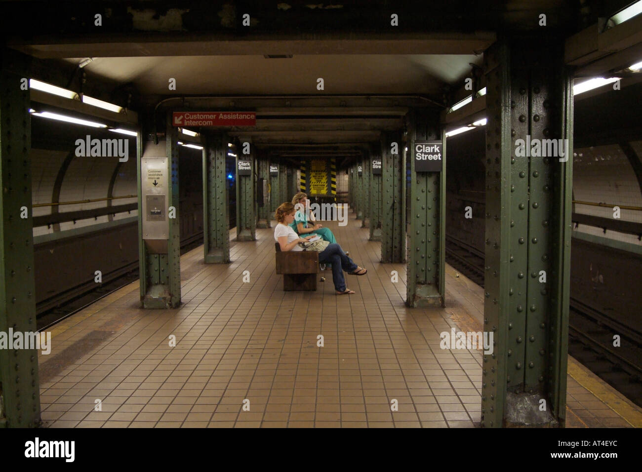 Clark Street subway station Brooklyn New York USA. Women wait for train