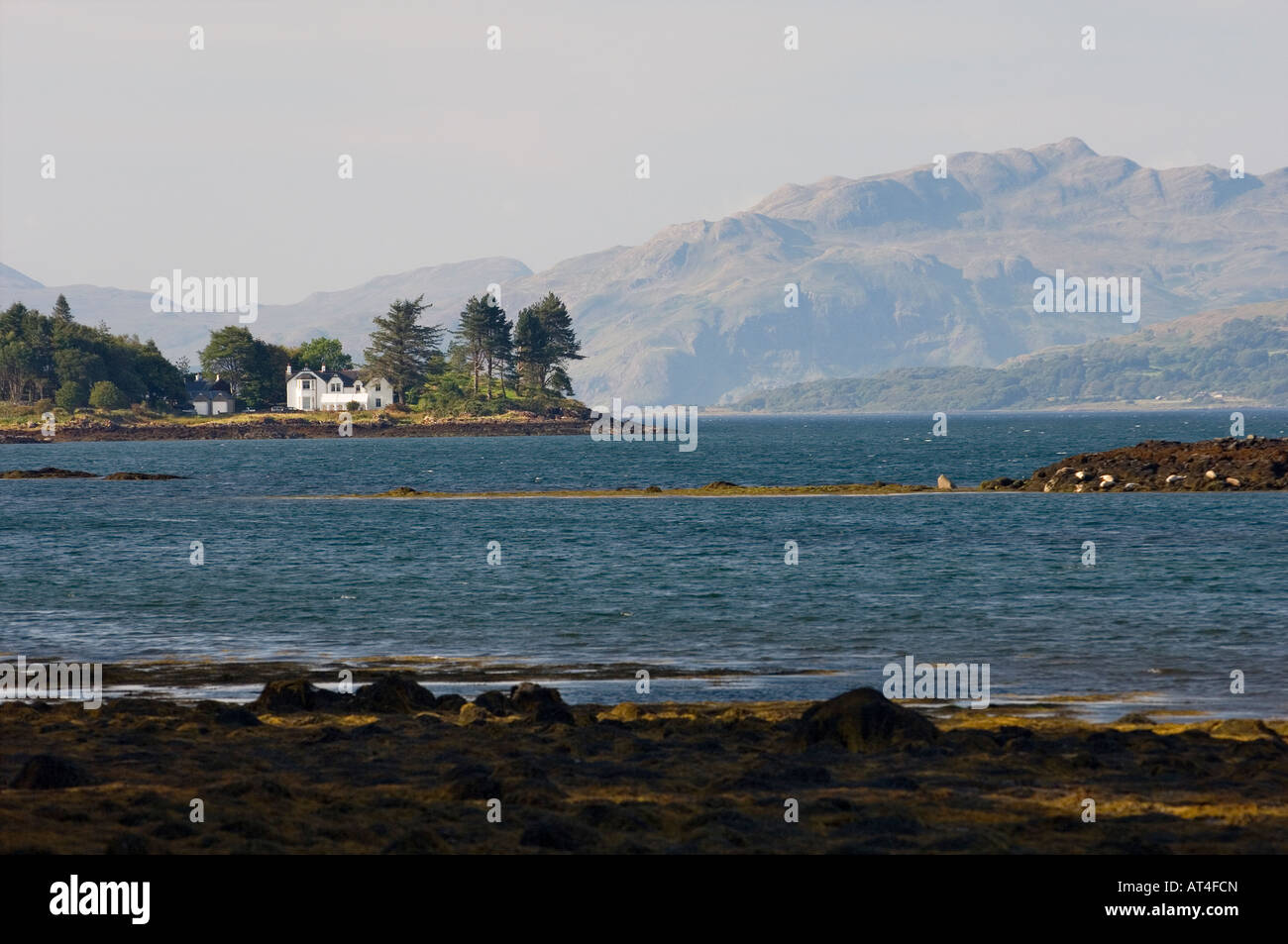 Isle of Mull, Inner Hebrides, Scotland. The mountains of Ardnamurchan rise behind Salen Bay and the Sound of Mull Stock Photo