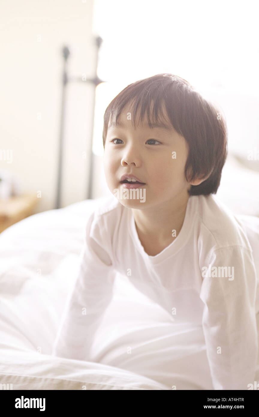 Young Boy Wearing White in Bed Stock Photo Alamy