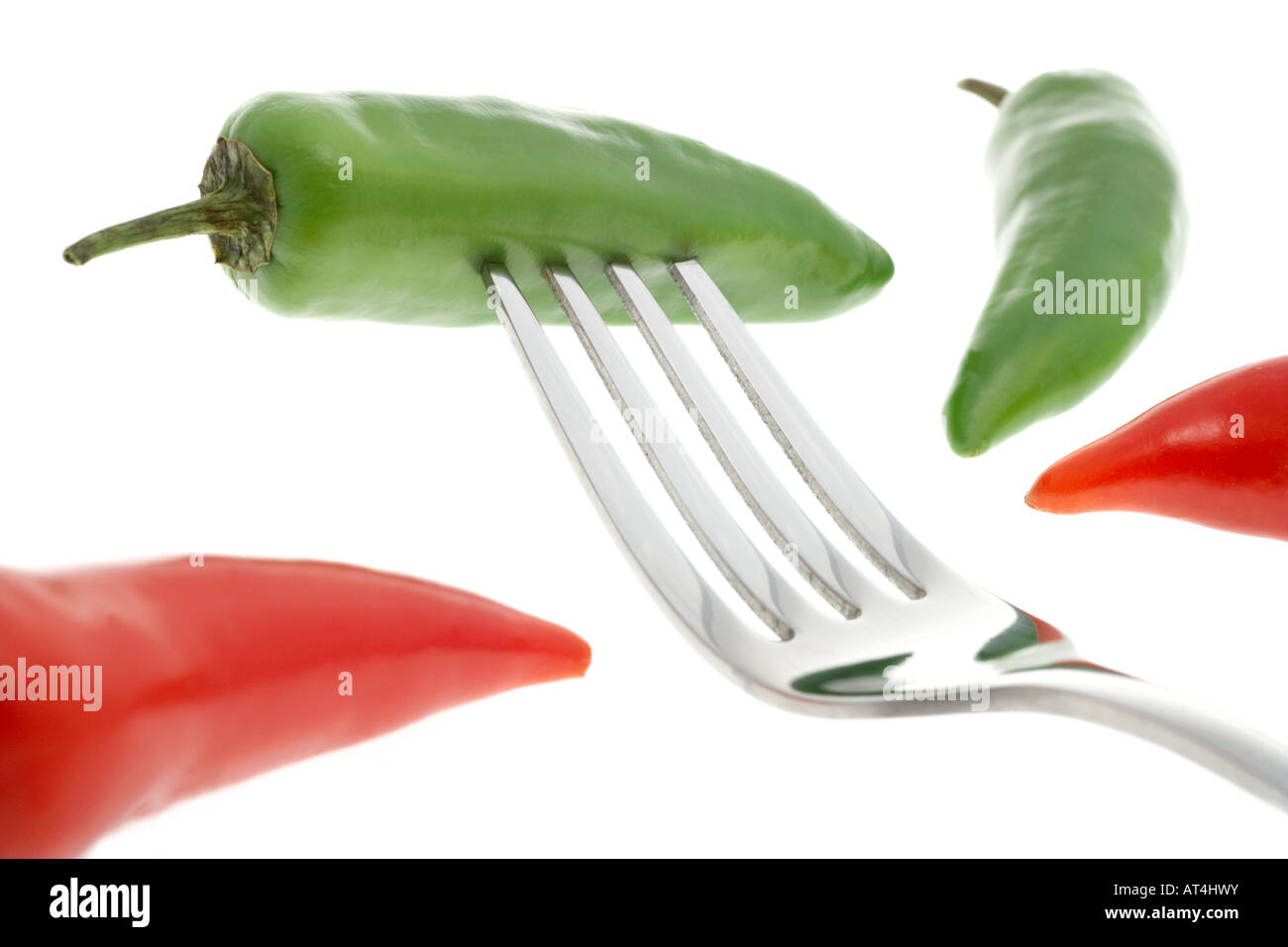 Green Chilli Pepper on a Fork Stock Photo