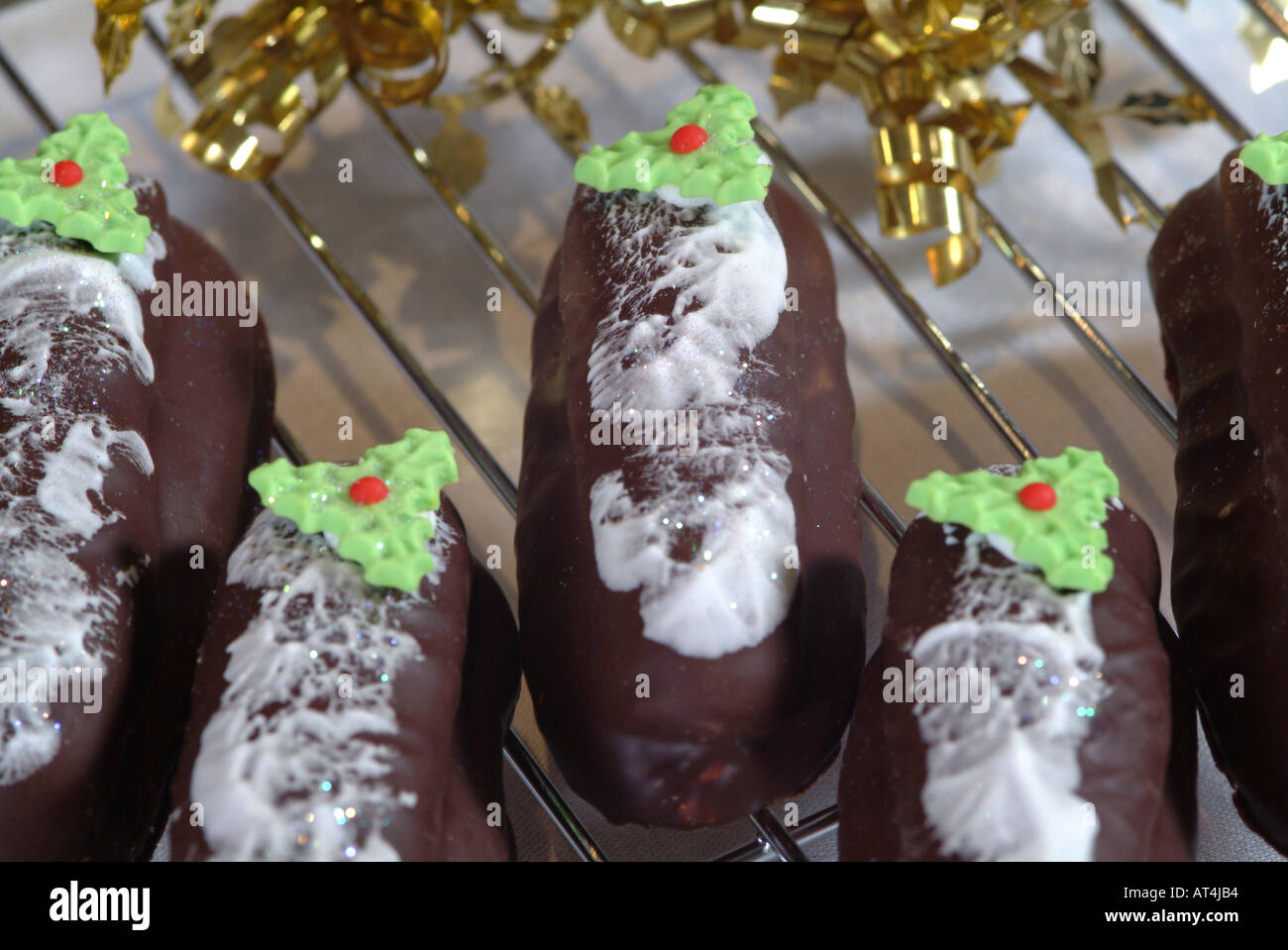 A Selection of Fancy Cakes on Wire Rack Designed for the Christmas Market Stock Photo