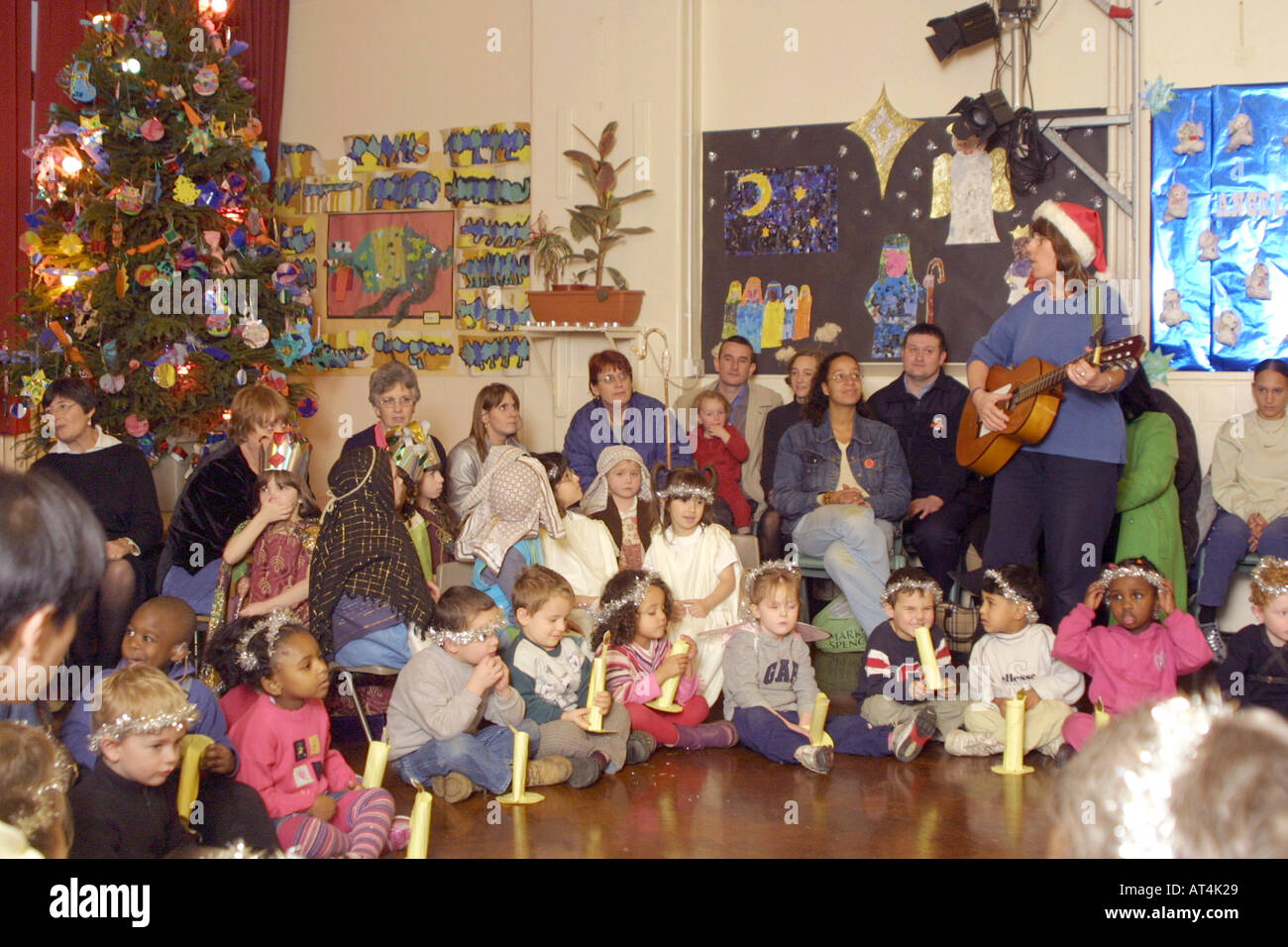 Primary school children celebrating Christmas at school assembly Stock