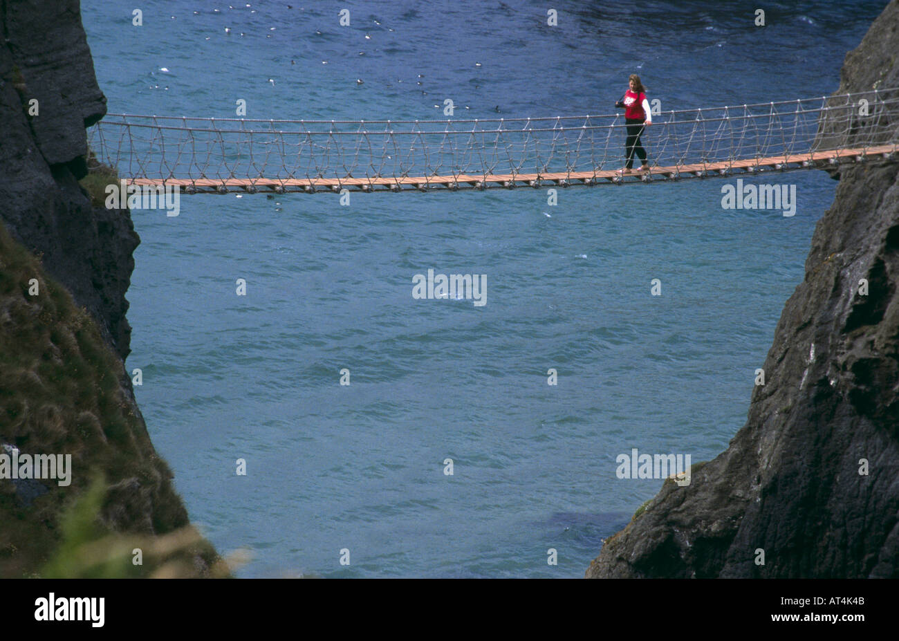 One Person on Carrick-A-Rede Rope Bridge County Antrim Northern Ireland  Stock Photo - Alamy