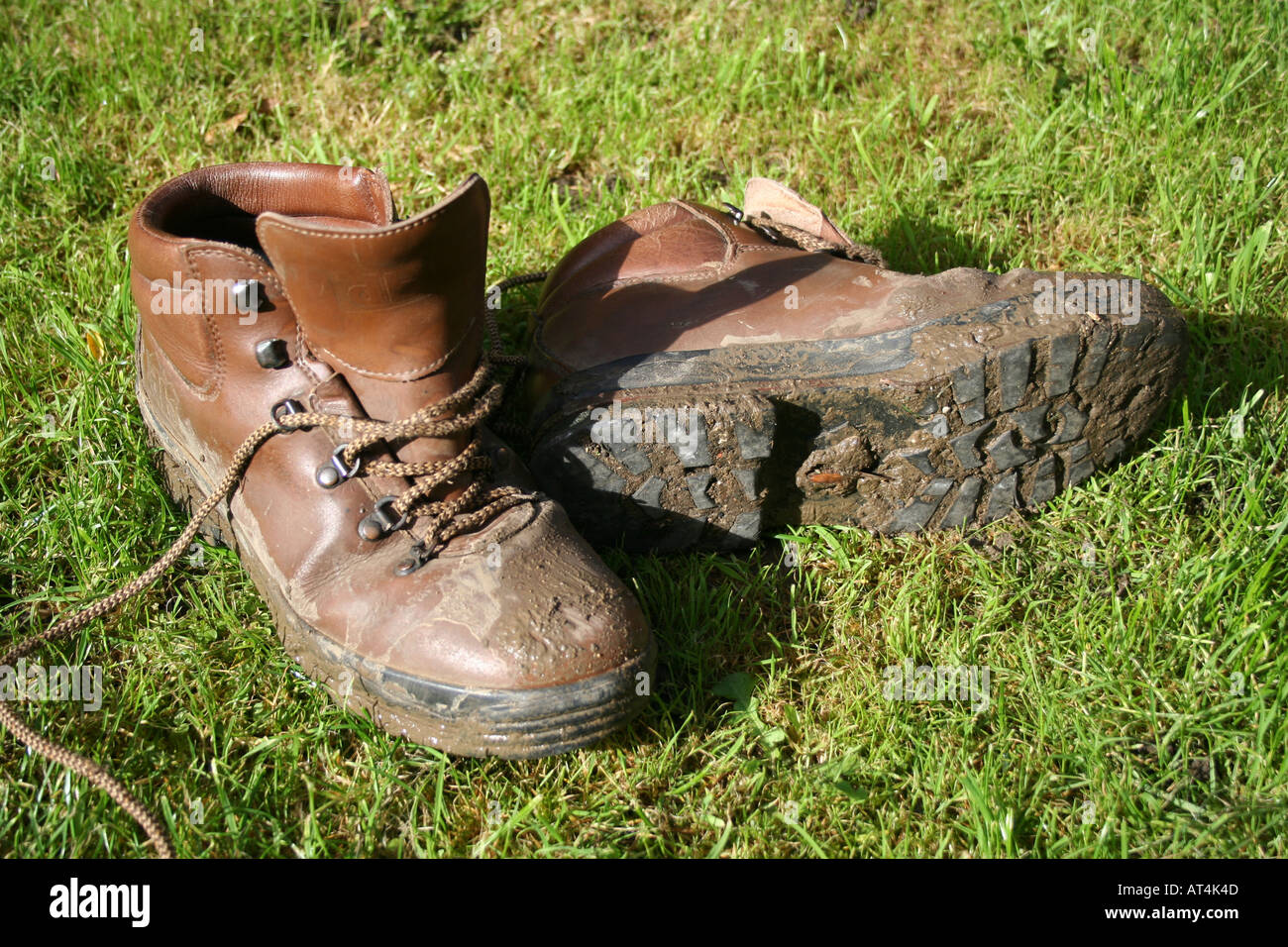 Muddy Boots on the grass Stock Photo - Alamy