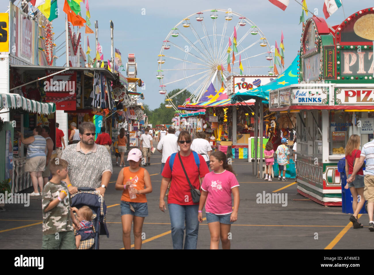 Family walking on the Midway at Erie County Fair and Expo in Hamburg
