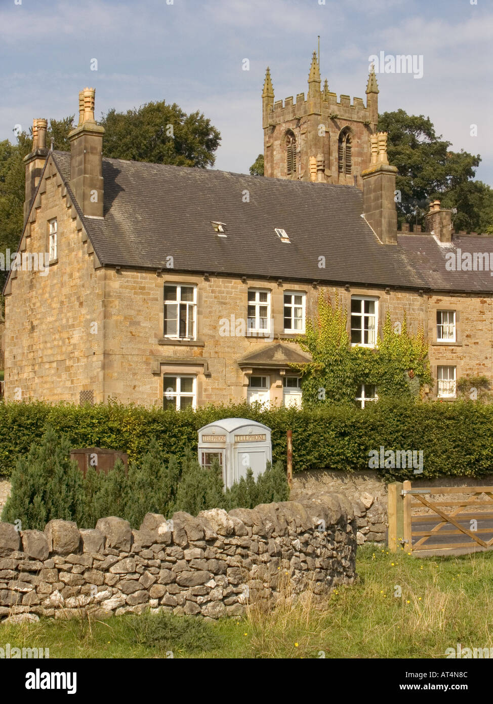 Derbyshire Peak District Hartington church tower above village houses ...