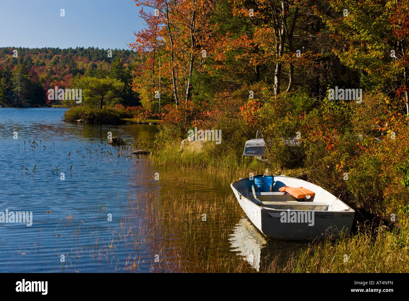 Boats on the shoreline of Long Pond in Lempster, New Hampshire Stock