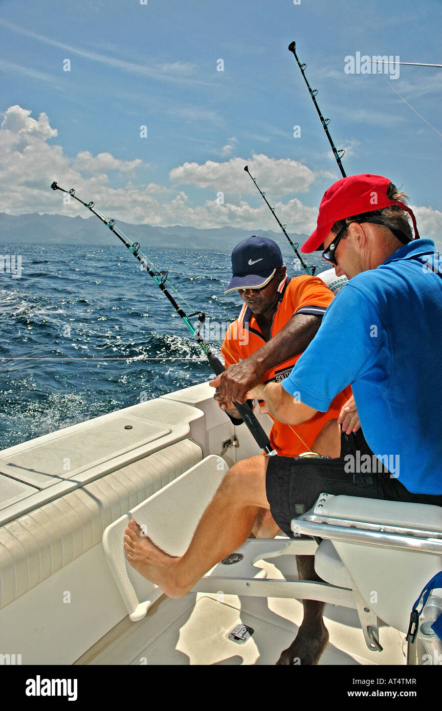 Offshore angler battles big game fish in Caribbean Stock Photo - Alamy