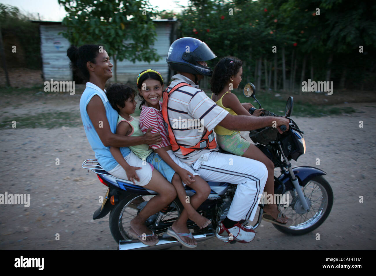 Taxi transport in Colombia often 5 to 6 people sit on a motorbike Stock Photo