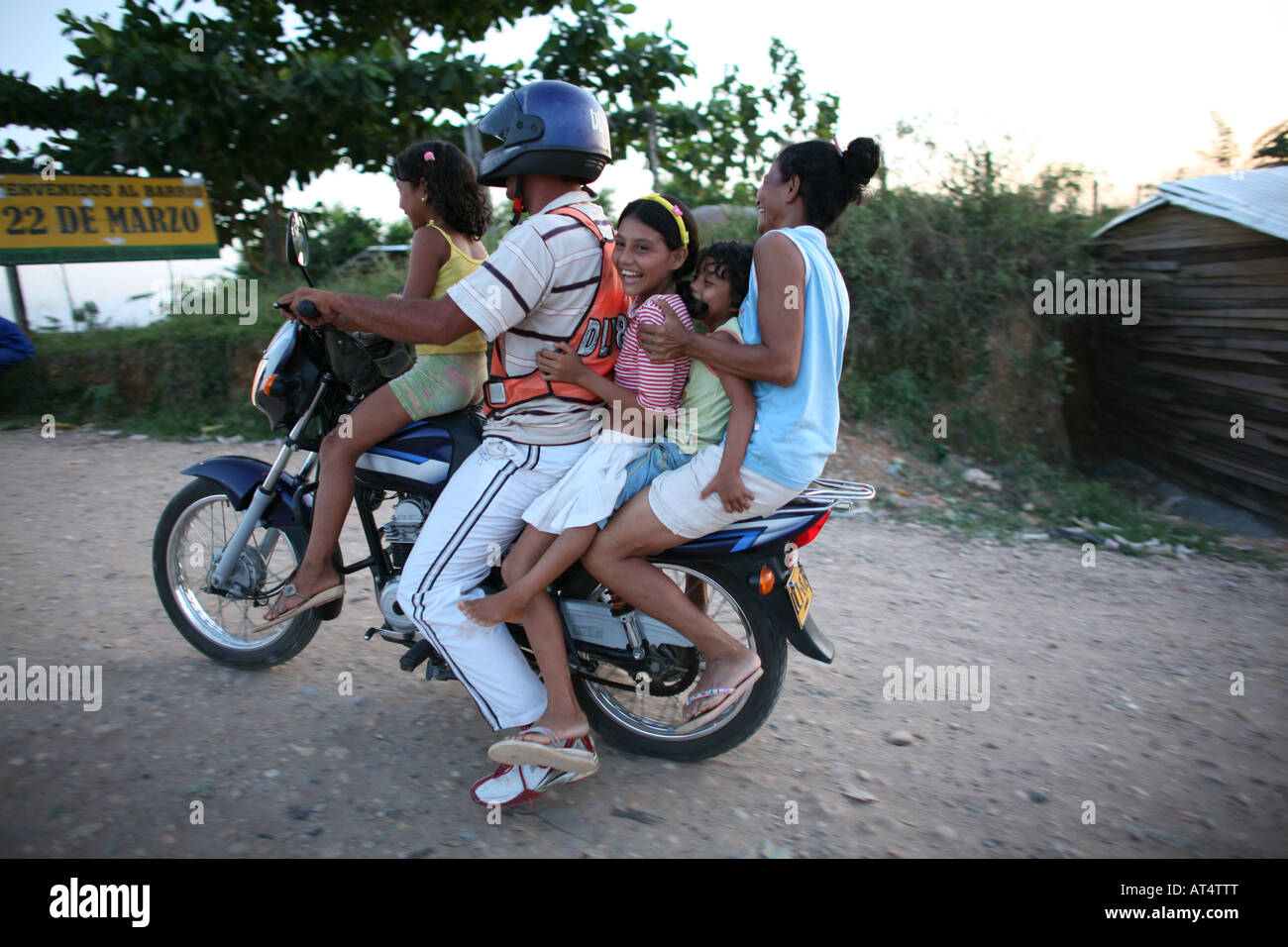 Taxi transport in Colombia often 5 to 6 people sit on a motorbike Stock Photo
