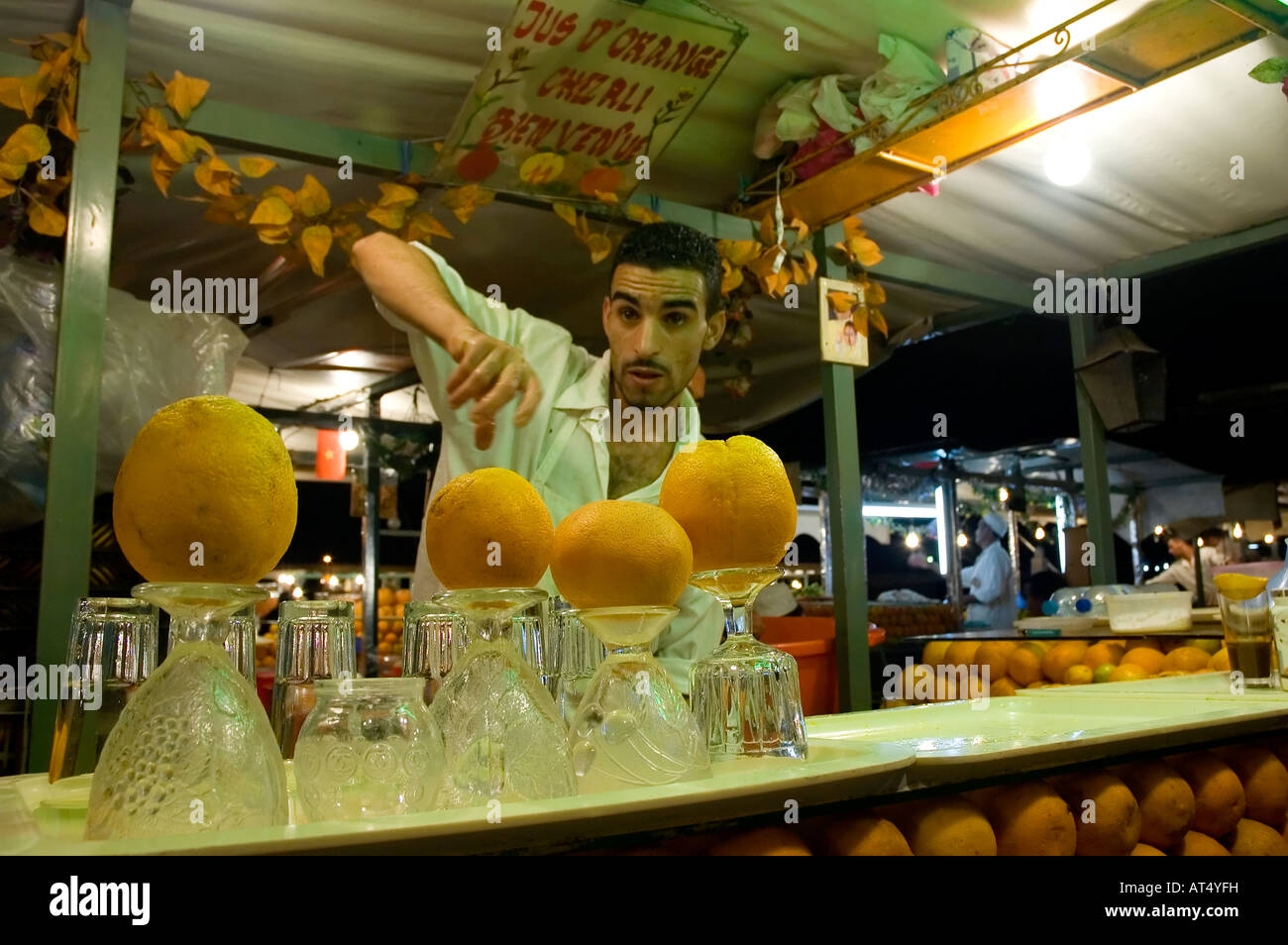 Orange juice seller offer a drink during the night in Djemaa el Fna