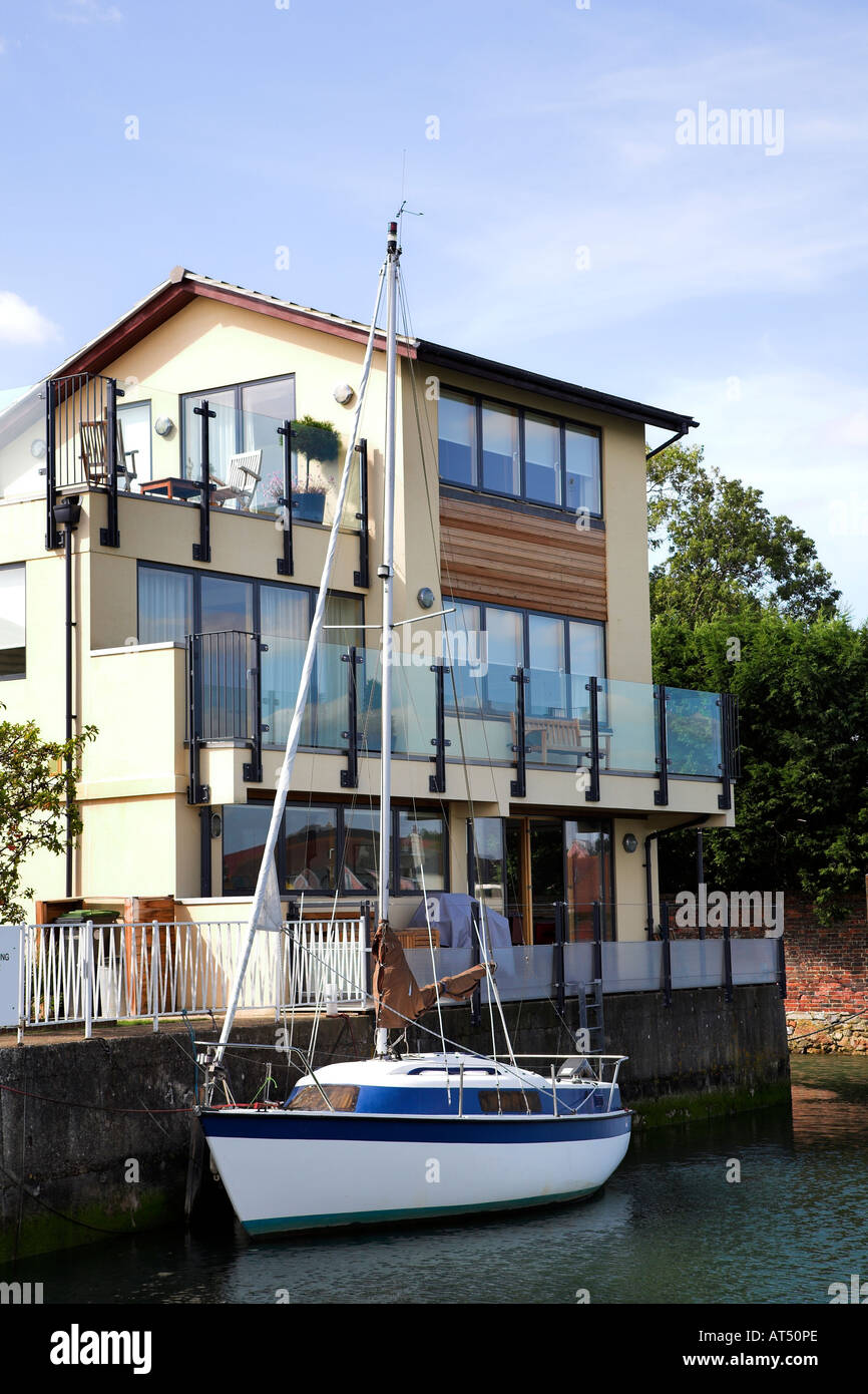 Sailing boat moored by a residential house at Emsworth, Chichester