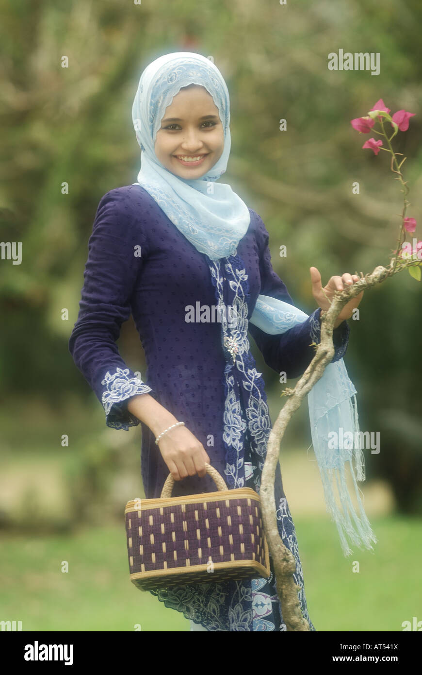 Cute Malaysian Girl with Scarf And Wear Modern Kebaya And Batik 