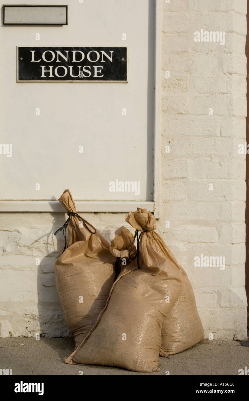 sandbags outside house, Borth, Ceredigion Wales, protection against high tides and  in case of floods, UK Stock Photo
