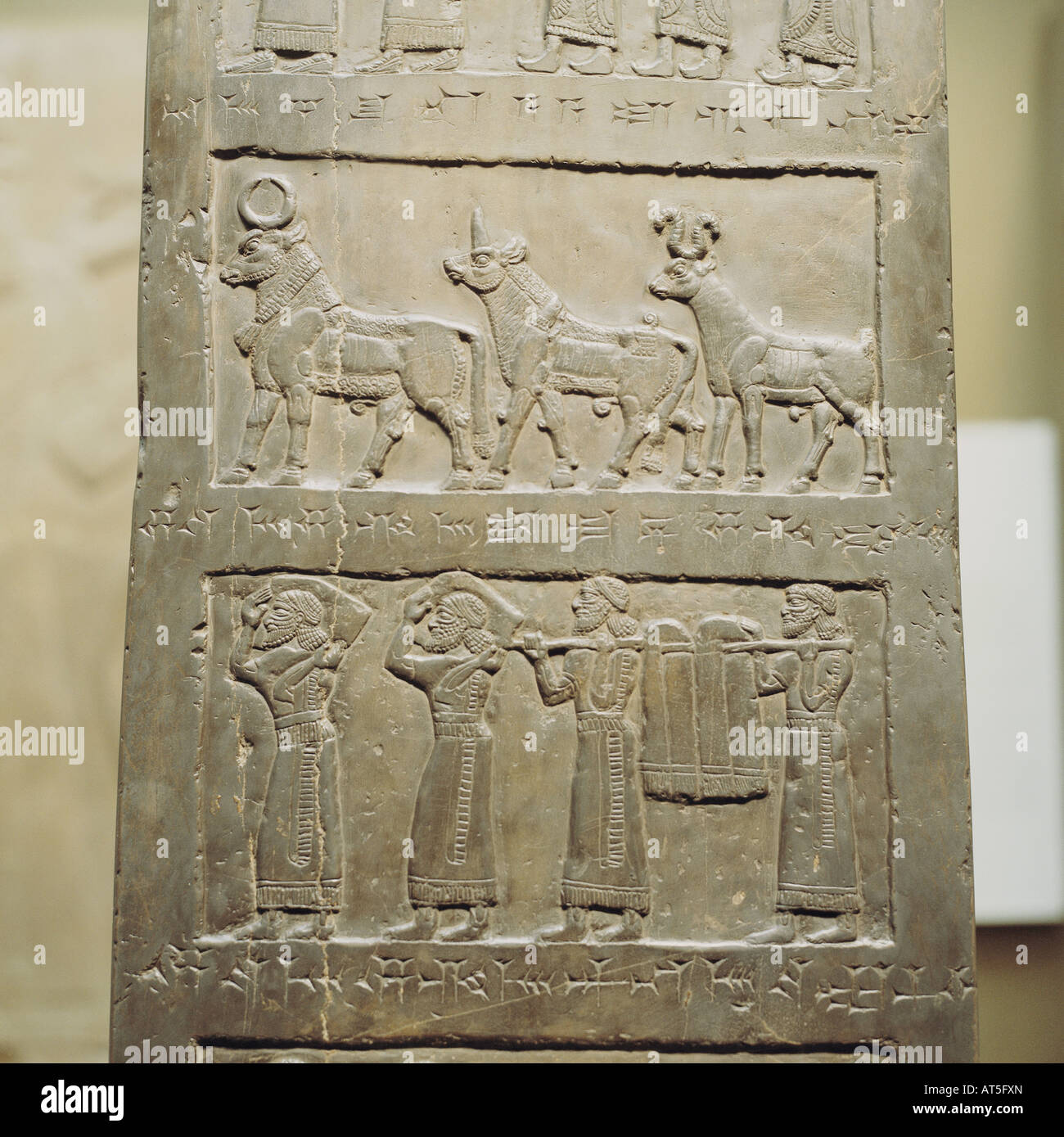 fine arts, ancient world, Assyrians, above: bull, capricorn and ram, below: Phoenicians bringing tribute, diorite, obelisk of King Shalmaneser II (reigned 858 - 824 BC), palace at Nineveh, British Museum, London, , Artist's Copyright has not to be cleared Stock Photo