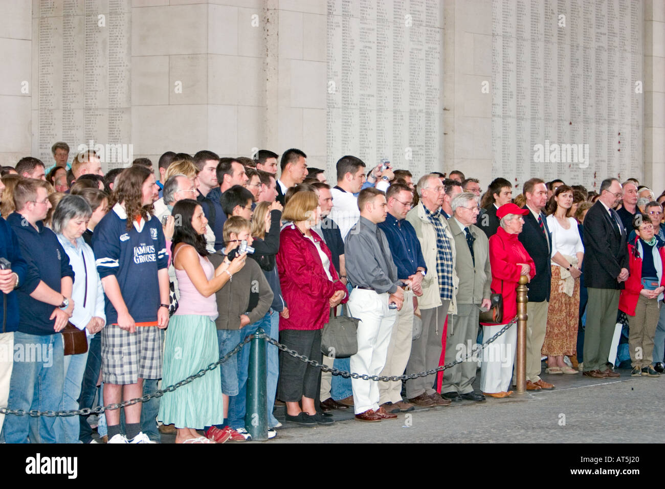 Large group of people attend Last Post service at Menin Gate Ypres Stock Photo