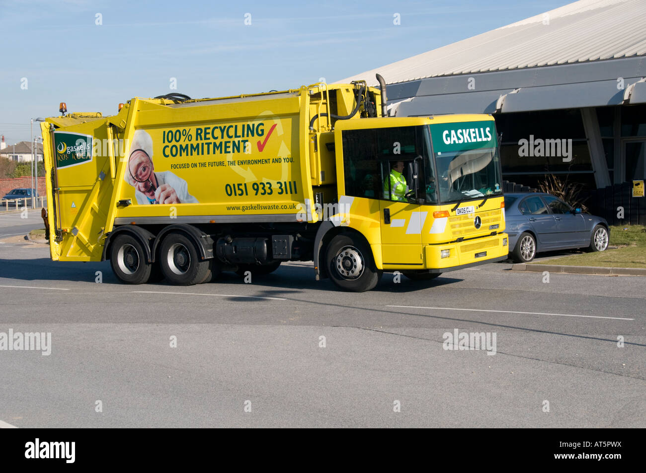 Yellow Gaskells recycling truck pulling into Crosby leisure centre Sefton Merseyside UK Stock Photo