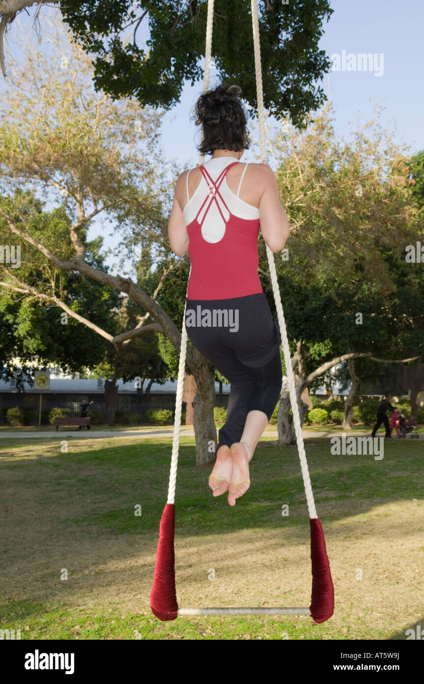 Female acrobat on a trapeze Stock Photo