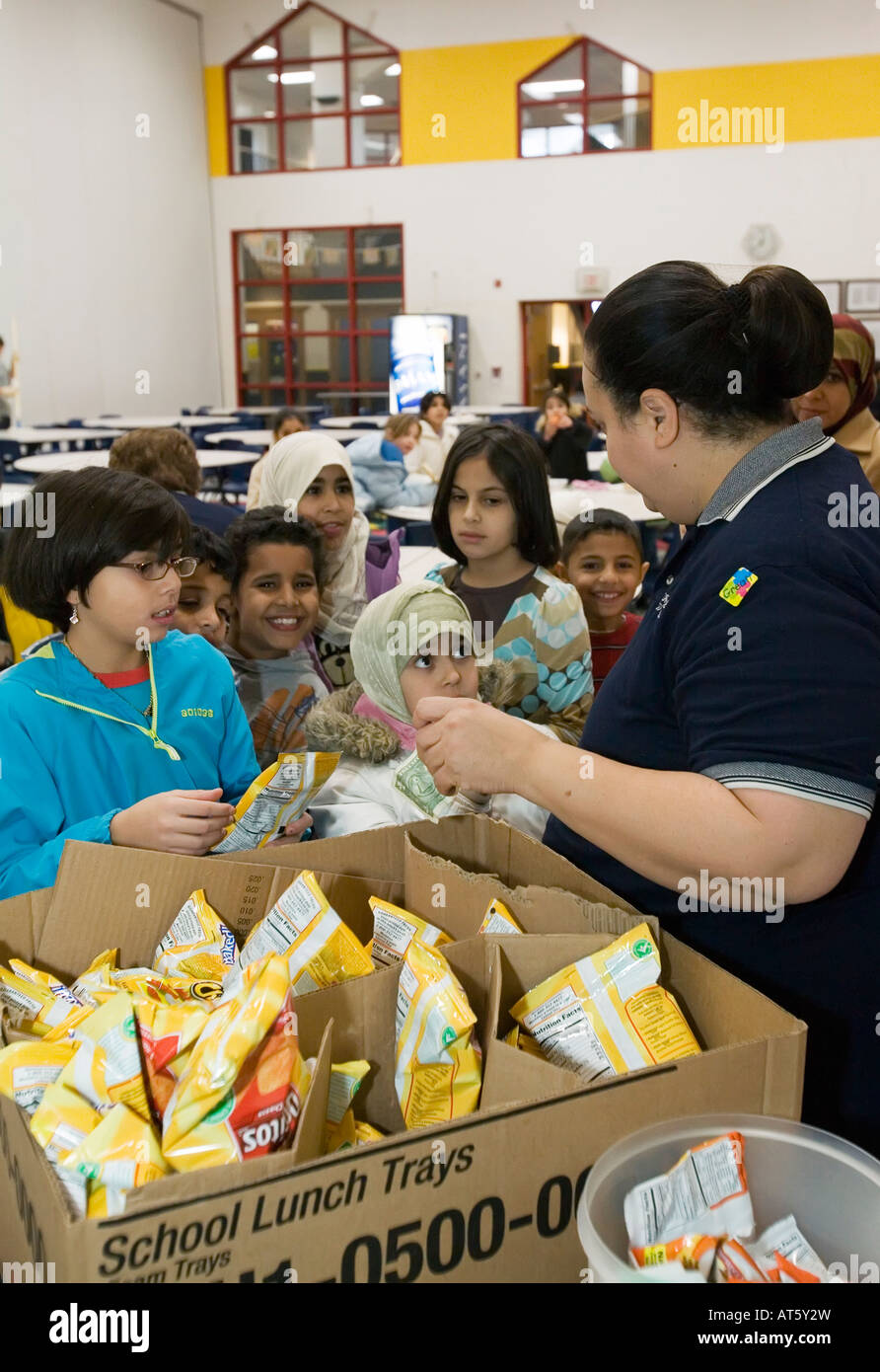 Dearborn Michigan Adilia Mohassen sells snacks in the cafeteria at Miller Elementary School Stock Photo