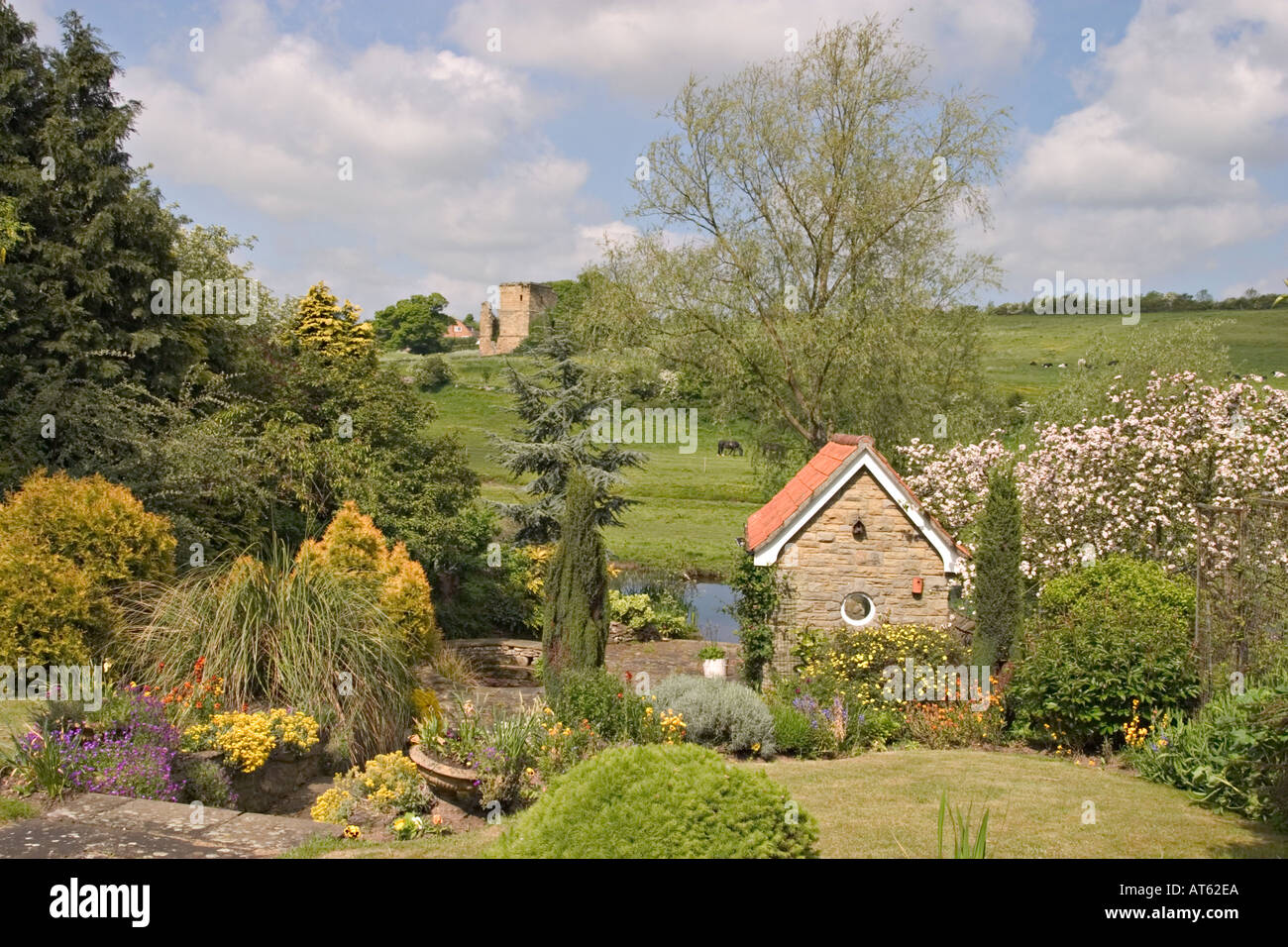 Spring garden overlooking River Derwent and Ayton Castle near