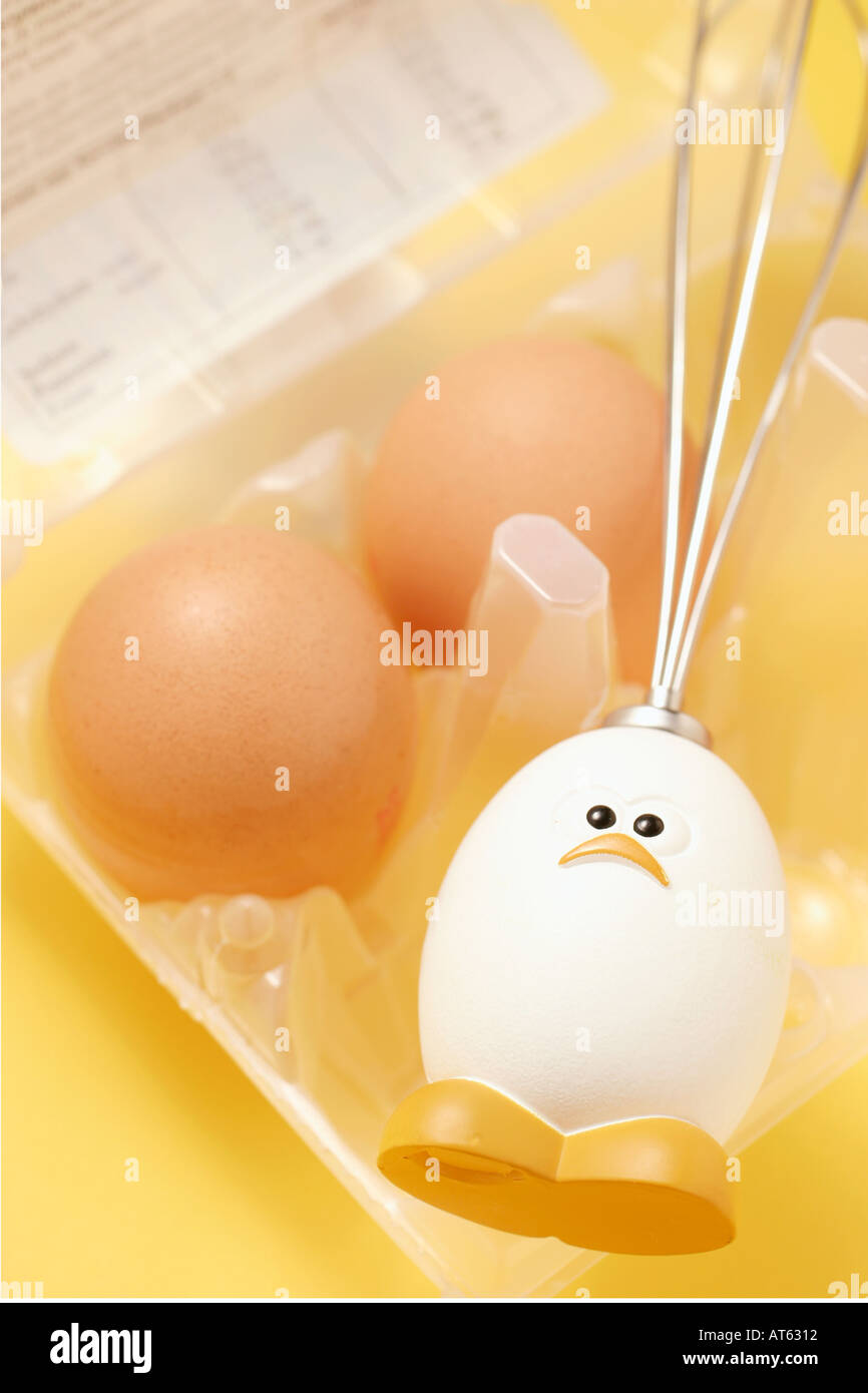 Egghead Whisk and Eggs on Carton Stock Photo
