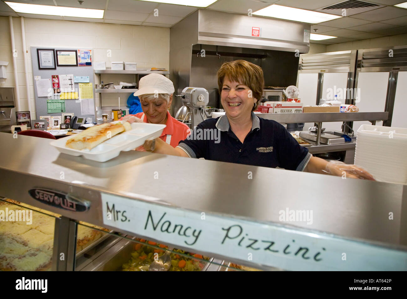 Dearborn Michigan Nancy Pizzini right and Marilynn Hassen work in the cafeteria at Miller Elementary School Stock Photo