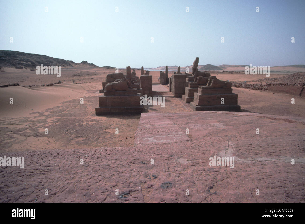 The avenue of sphinxes and the temple. Wadi al-Sebua, New Sebua, Upper Egypt, Egypt. The temple was built by Ramsess II and was moved from the rising waters of Lake Nasser in the 1970s. Stock Photo