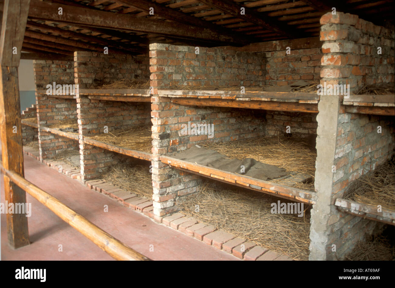 Sleeping area beds at Auschwitz Nazi death camp site of the Jewish Holocaust during World War Two 2 Stock Photo