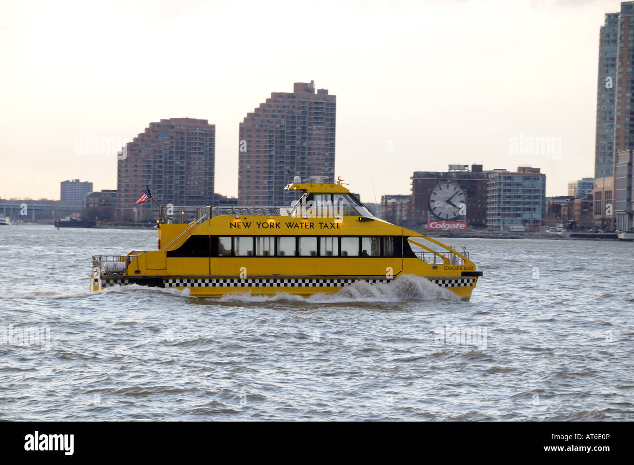 A New York Water Taxi on the Hudson River with Jersey City in the