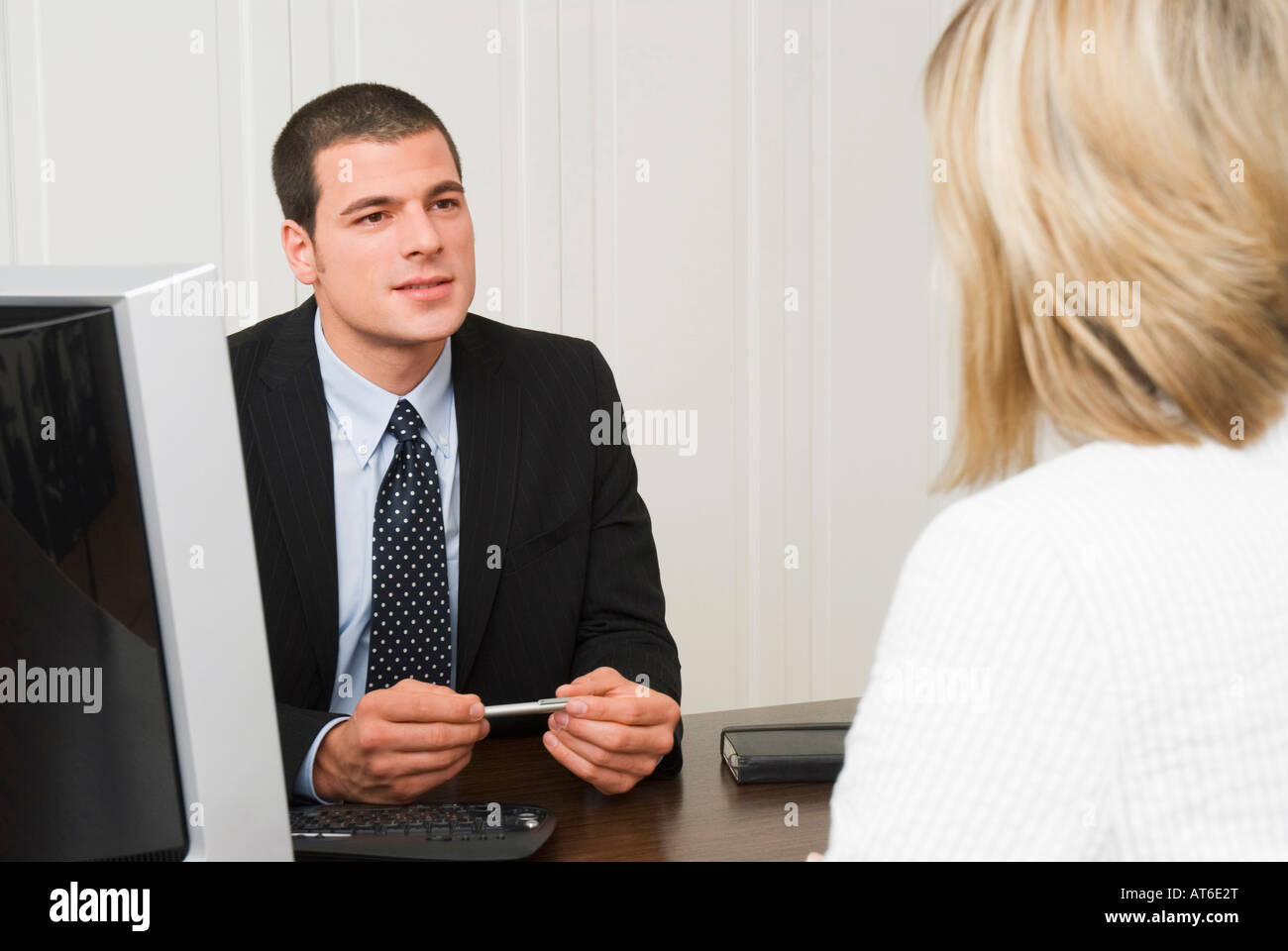 Bank representative talking with client Stock Photo