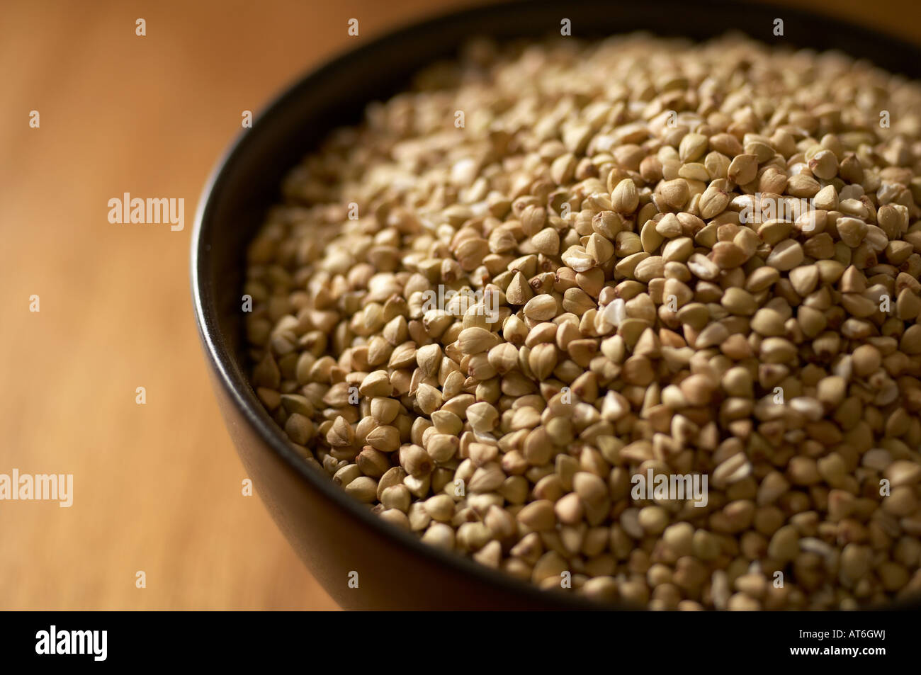 Buckwheat in bowl close up Stock Photo