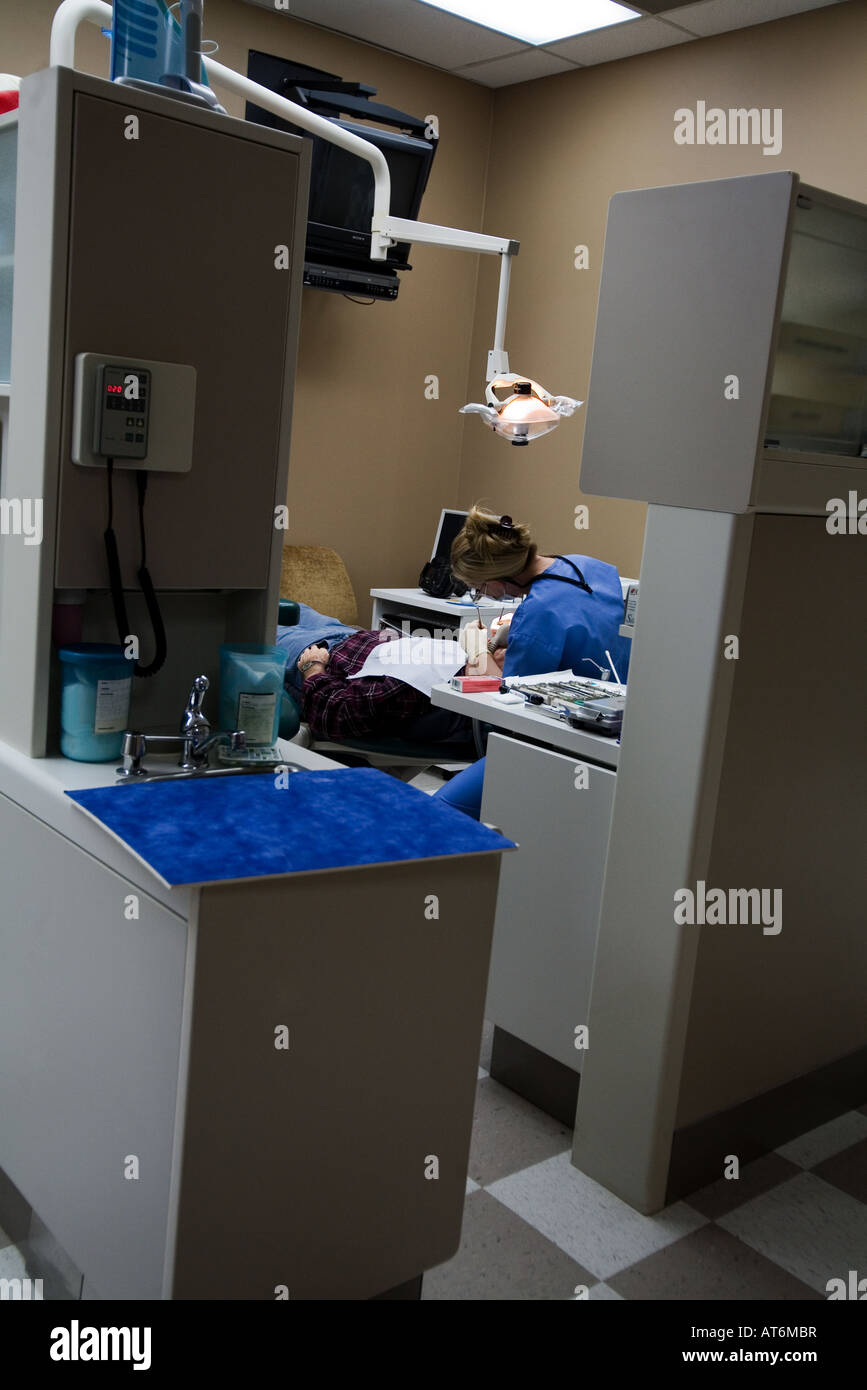 Procedure on patient in a dental office Stock Photo