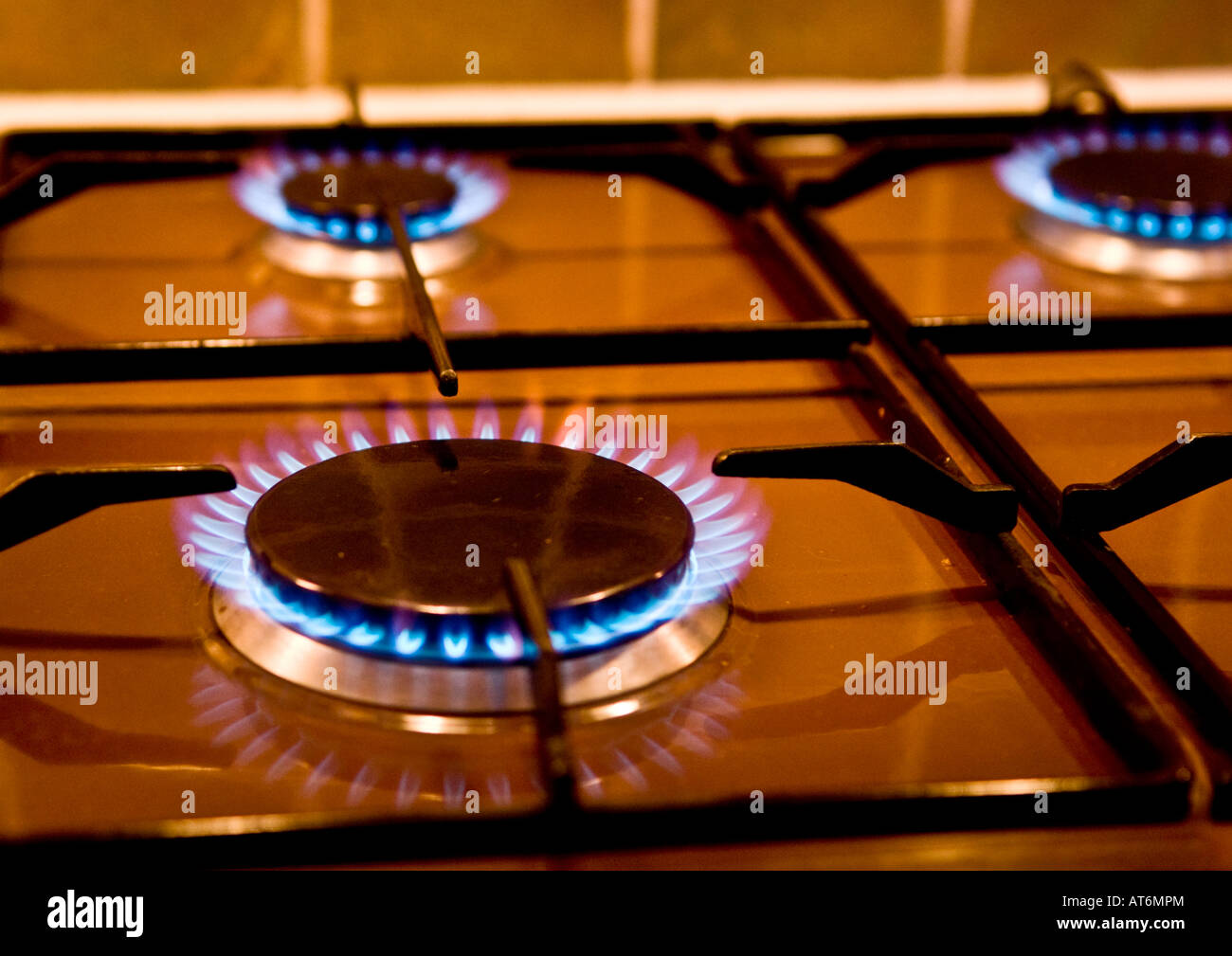 Three burners alight on gas hob Stock Photo Alamy
