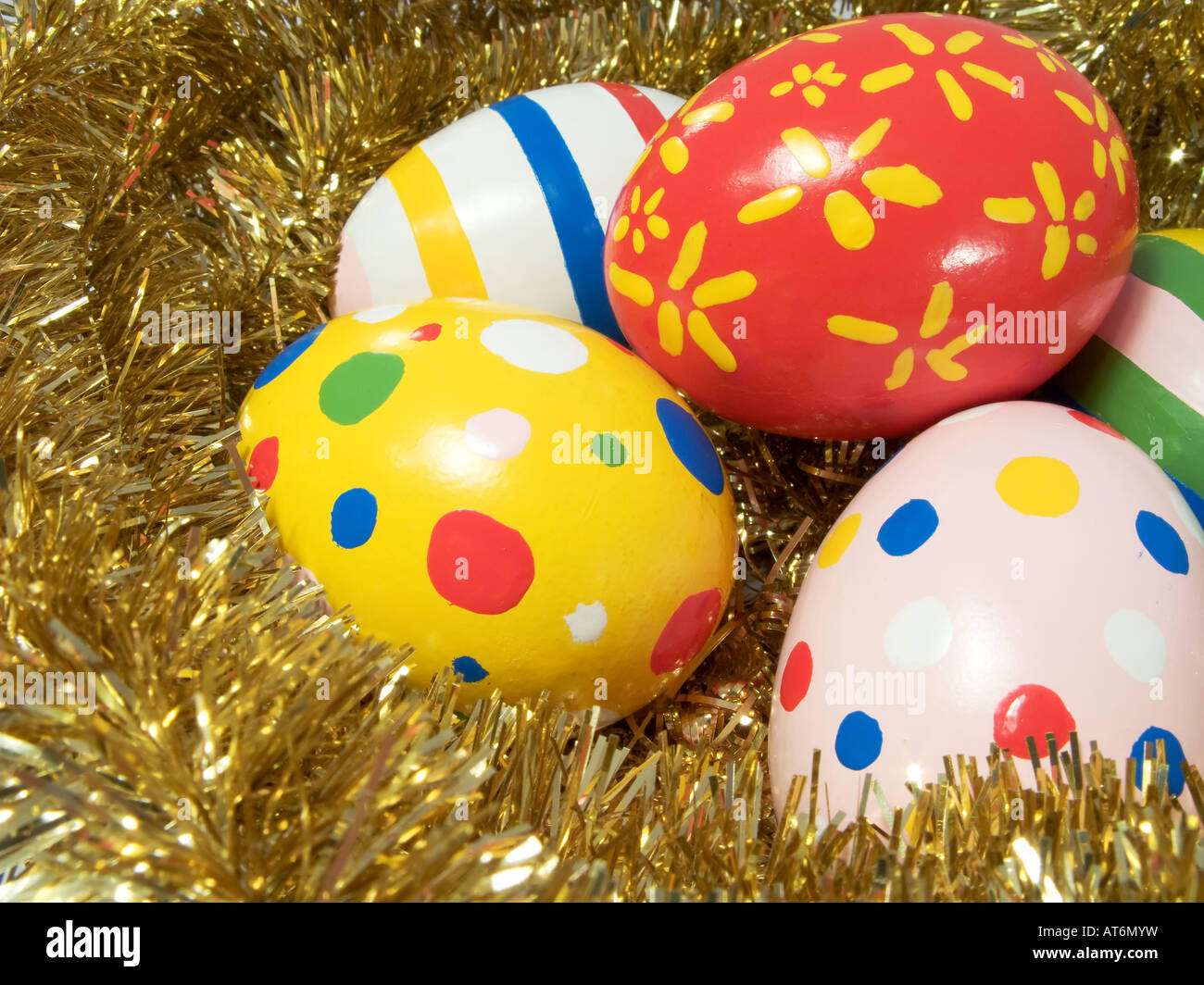 Real hand painted Easter eggs in a golden nest Stock Photo - Alamy
