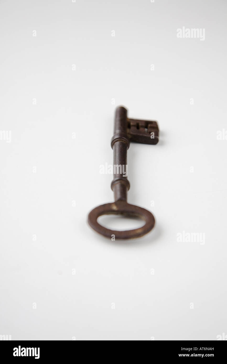 Old iron key on white back ground Stock Photo