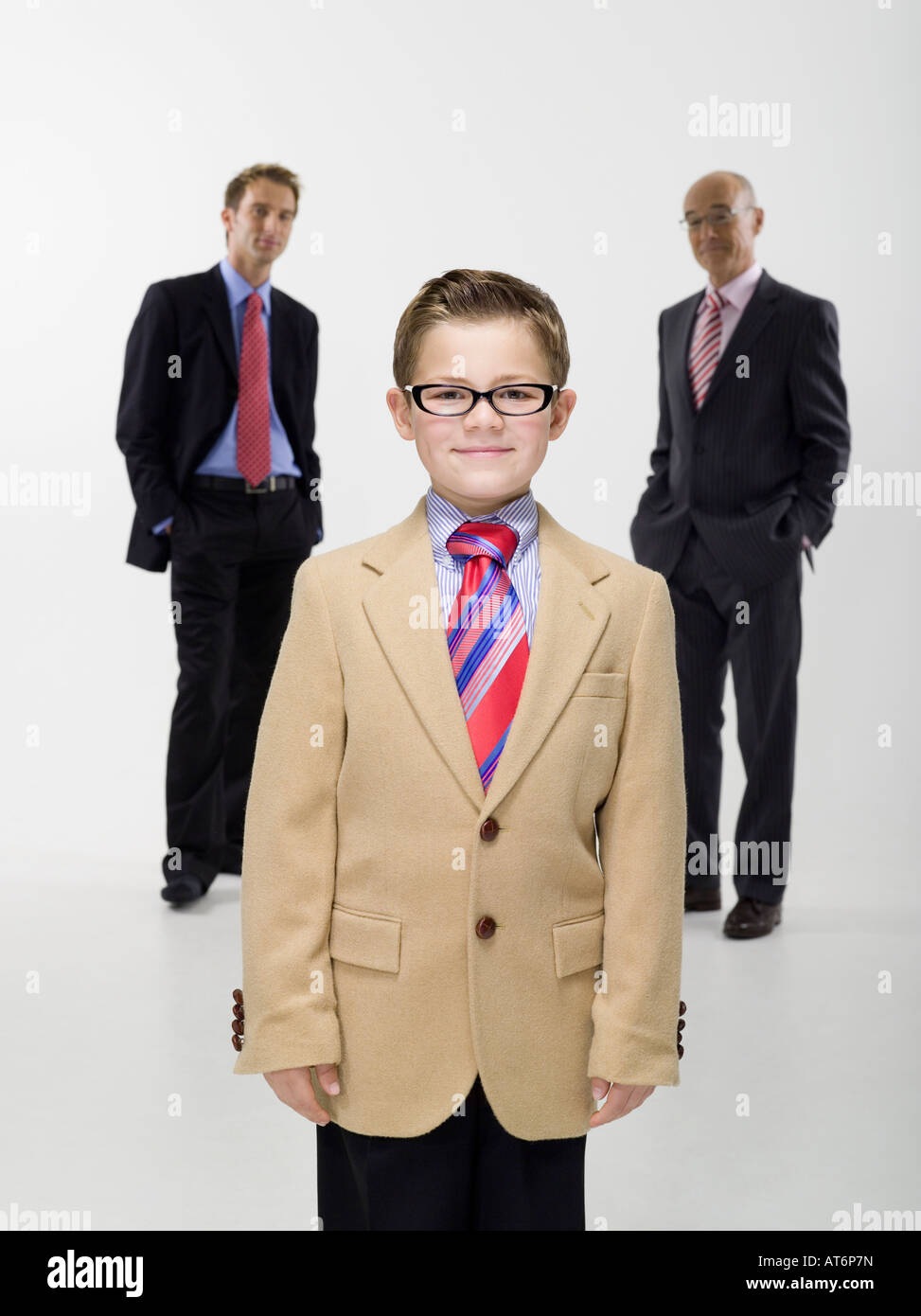 Grandson (8-9) grandfather and son wearing business cloth, portrait Stock Photo