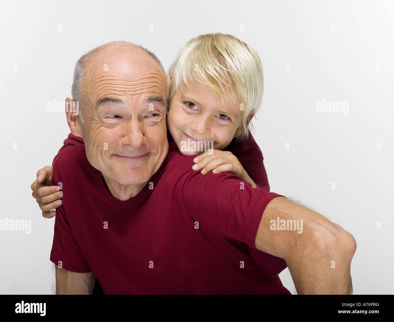 Grandson 8 9 Embracing Grandfather Smiling Portrait Stock Photo Alamy