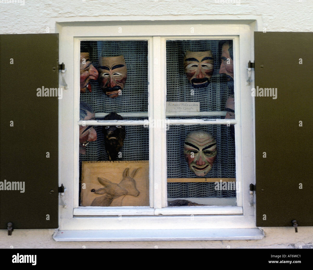 Wooden mask-maker' s window display in Bavaria Stock Photo - Alamy