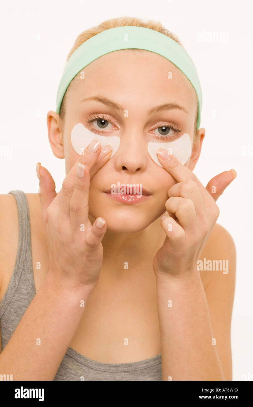 Woman applying adhesive plaster over nose, portrait Stock Photo Alamy