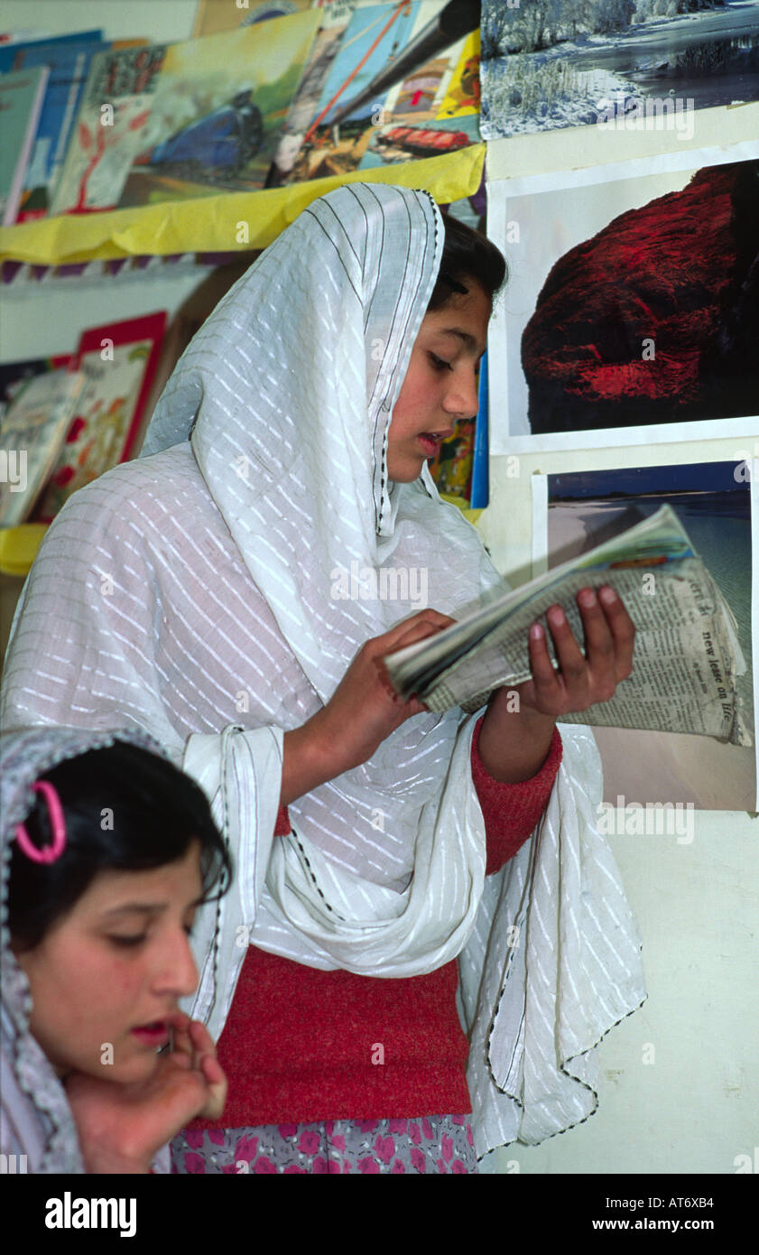 Veiled Muslim schoolgirl reading aloud to her classmates at the British model School in Quetta. Pakistan Stock Photo
