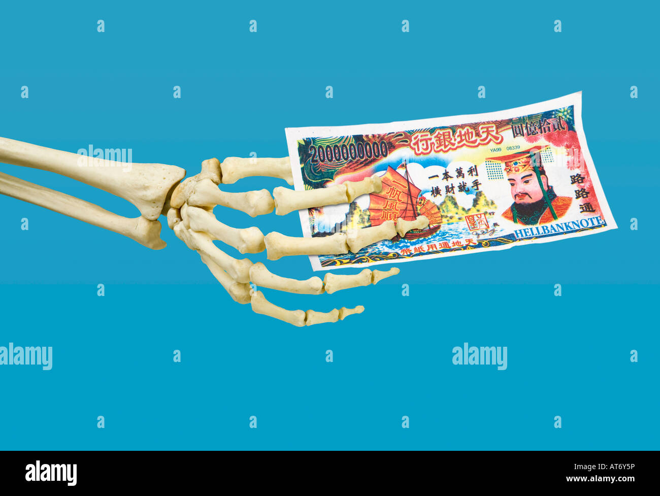skeleton right hand holding hell bank note Stock Photo