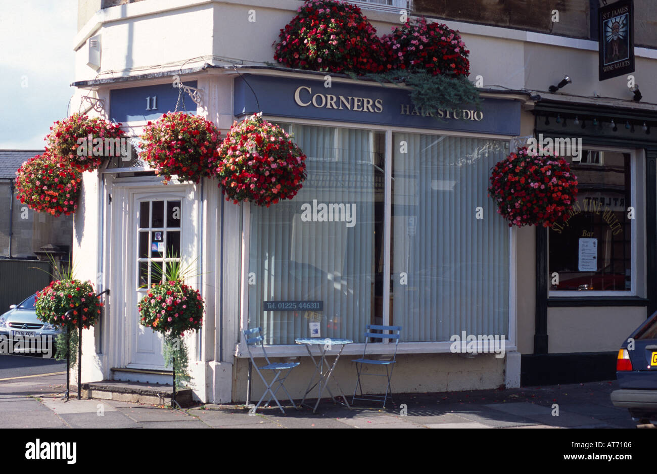 Hairdressers with hanging baskets on a corner Bath Spa, Somerset