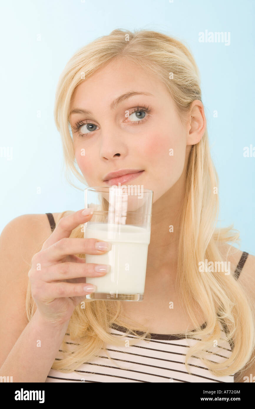 Woman drinking glass of milk, portrait Stock Photo Alamy