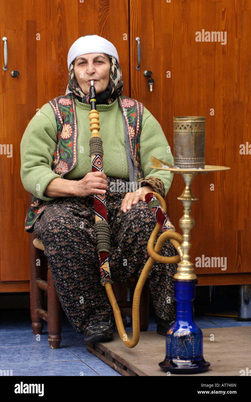 Turkish woman smoking a sheesha waterpipe in Istanbul, Turkey Stock
