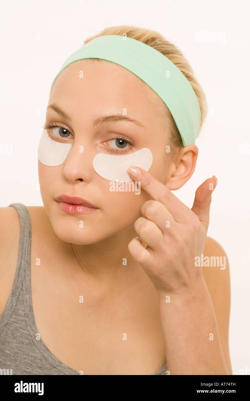 Woman applying adhesive plaster over nose, portrait Stock Photo Alamy
