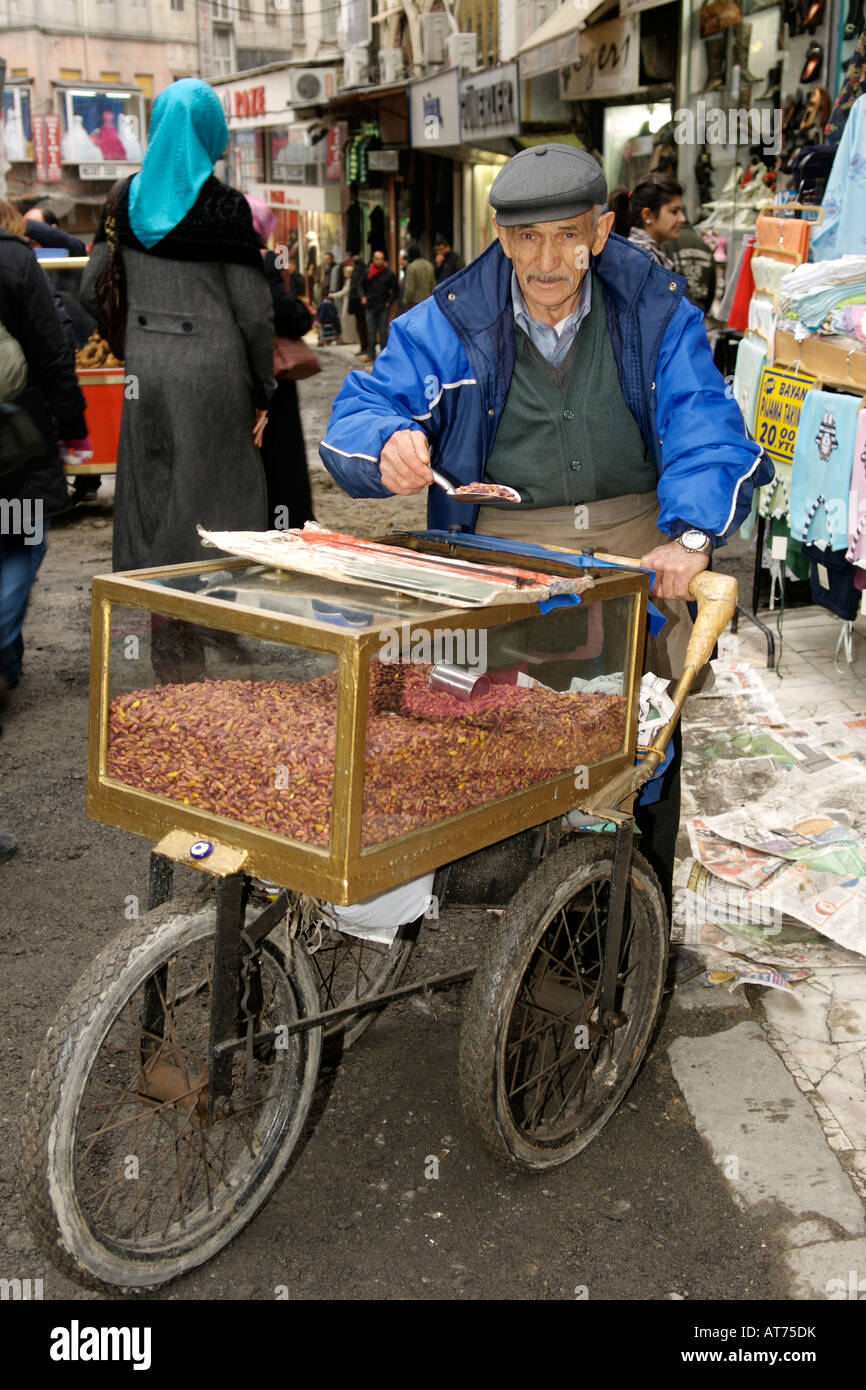 Elderly Turkish man selling pistachio nuts on a street in Istanbul. Stock Photo