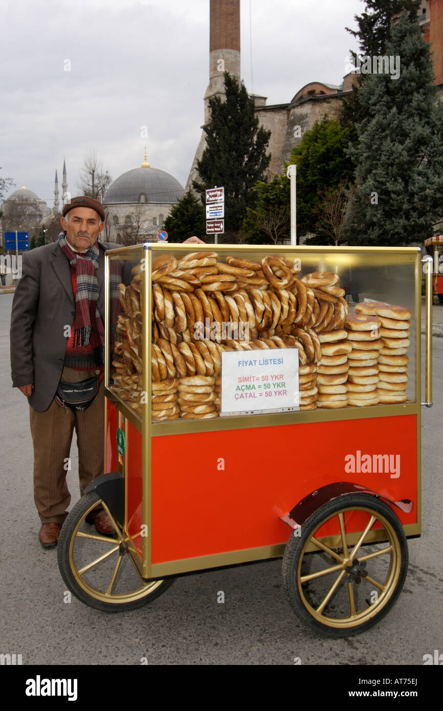 Turkish man with his bread-vending cart on a street in Istanbul. Stock Photo