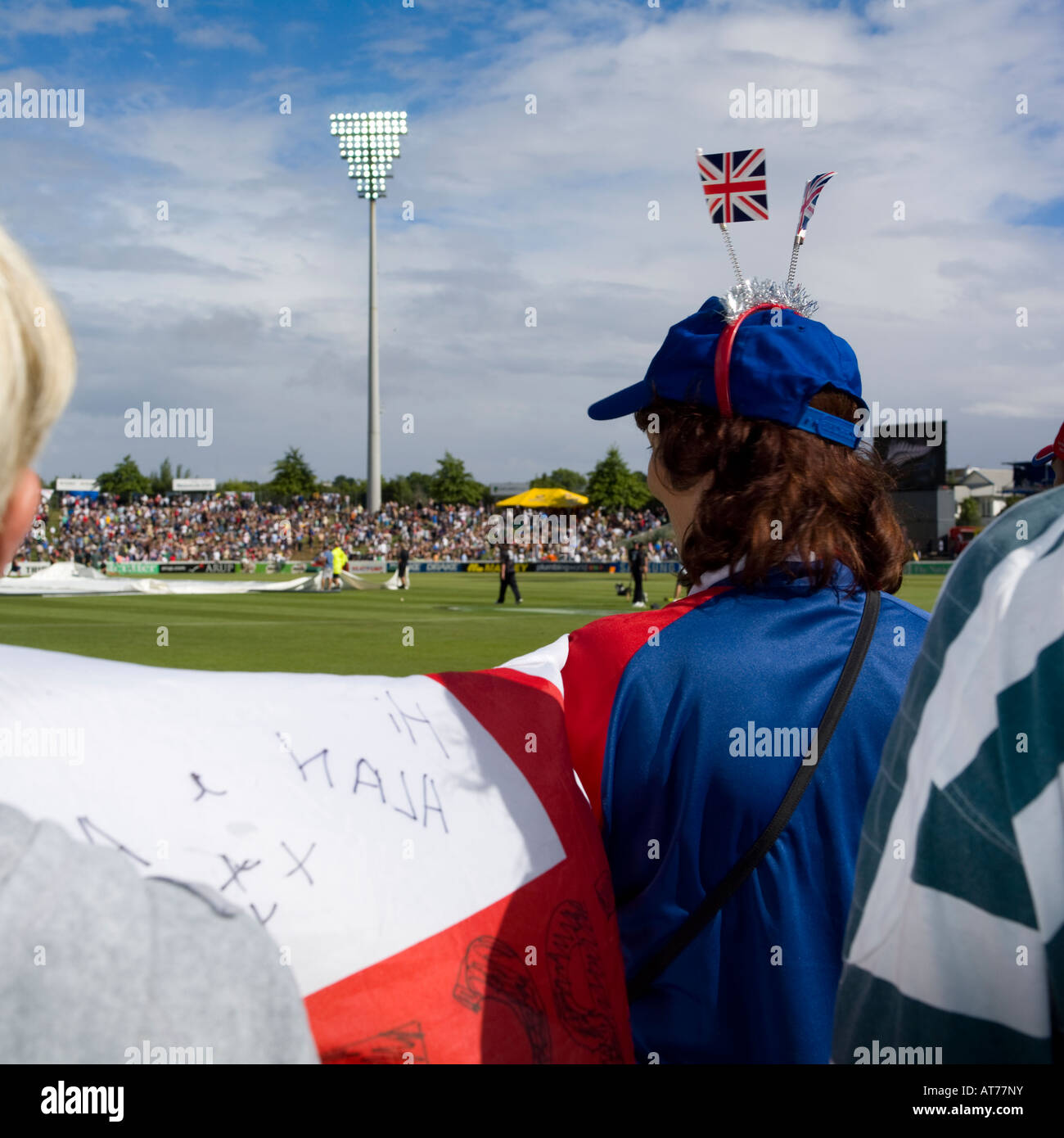 England fans with British flags on her hat with English flag in hand Stock Photo