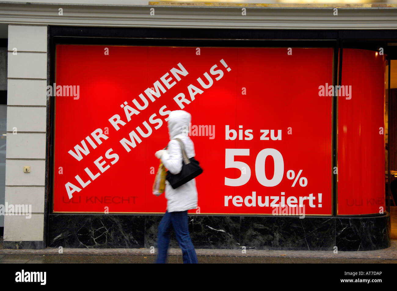 closing down shop sale ku-damm berlin germany deustchland red pedestrian 50 percent reduced window kurfurstendamm shopping Stock Photo