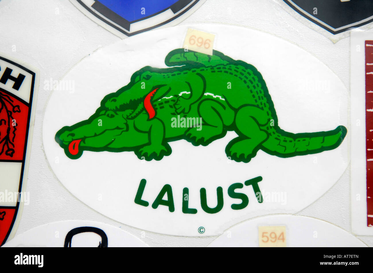 lacoste crocodile comic humour retro souvenir sticker badge berlin germany europe travel tourism Stock Photo - Alamy
